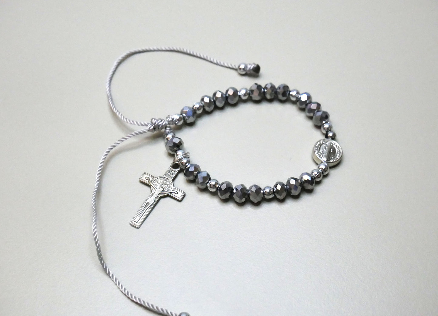 Handmade Silver Threaded Bracelet with St. Benedict Medal, Silver Beads, and Dangling Holy Cross for Protection