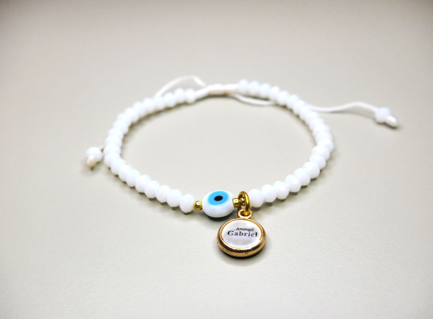 Crystal Bracelet with Dangling Archangel and Evil Eye Charms for Protection, Peace, and Style