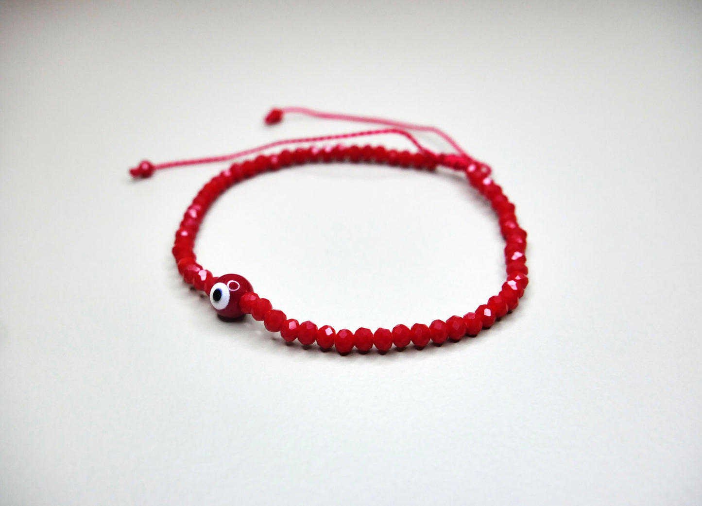 Handmade Red Crystal Bracelet with Center Evil Eye Charm for Style, Protection, and Positive Energy