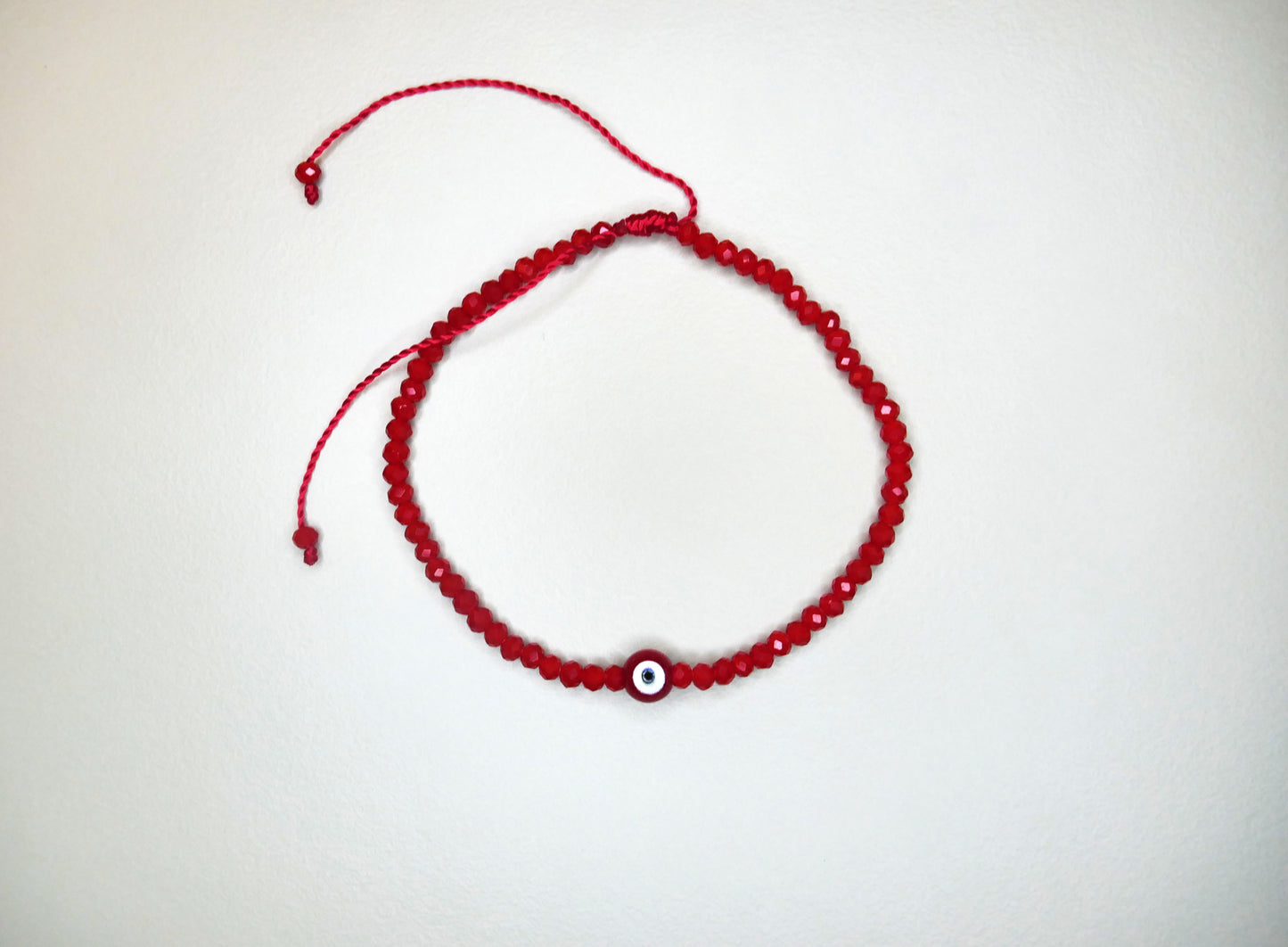 Handmade Red Crystal Bracelet with Center Evil Eye Charm for Style, Protection, and Positive Energy